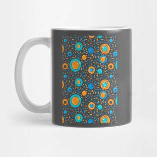 Vibrant orange and teal circles are scattered amidst an intricate array Mug